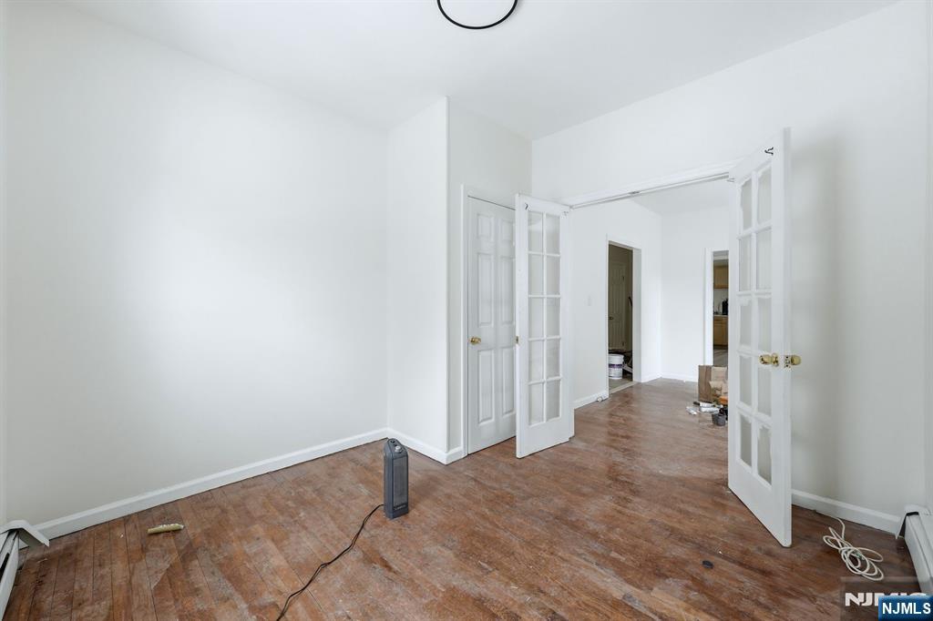 72 South 13th Street Newark, NJ 07107 - Photo 3 of 40 a view of a room with wooden floor and tub