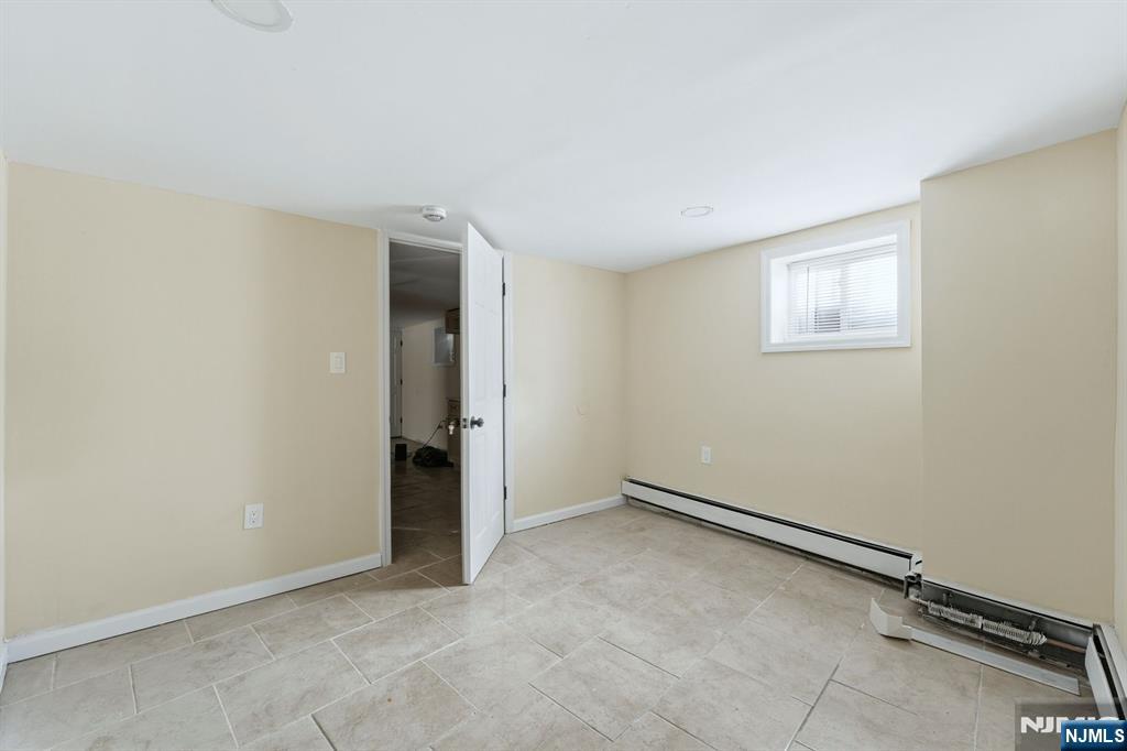 72 South 13th Street Newark, NJ 07107 - Photo 33 of 40 an empty room with a bench