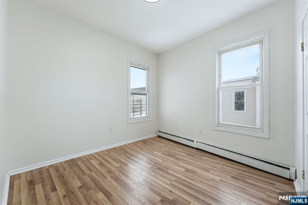 72 South 13th Street Newark, NJ 07107 - Photo 4 of 40 an empty room with windows