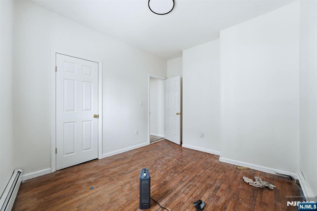 72 South 13th Street Newark, NJ 07107 - Photo 8 of 40 a view of room with wooden floor