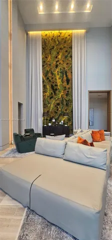 a bedroom with a large bed and a large window