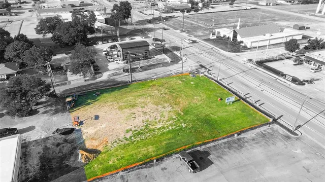a view of a swimming pool with a yard