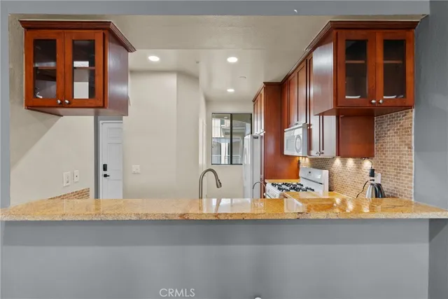 a view of a room with balcony and furniture