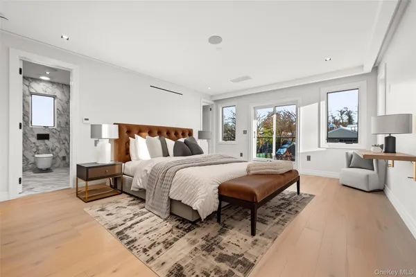 a bedroom with a large bed and a couch