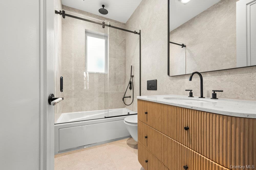 176-12 Kildare Road Queens, NY 11432 - Photo 22 of 34 a bathroom with a sink toilet and shower