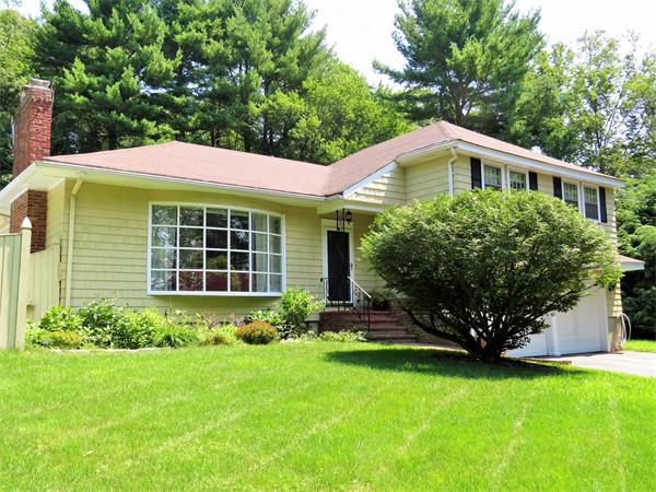 48 Prospect Road Andover, MA 01810 - Photo 1 of 23 a front view of a house with a yard