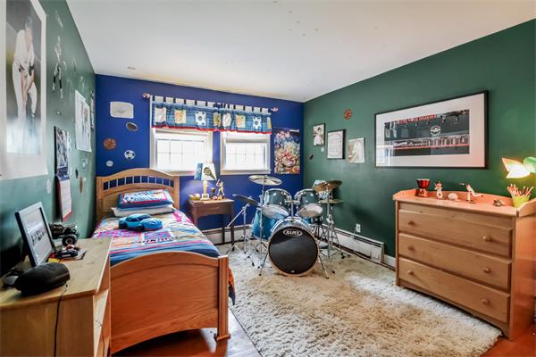 48 Prospect Road Andover, MA 01810 - Photo 17 of 23 a living room with furniture gym equipment and a large window