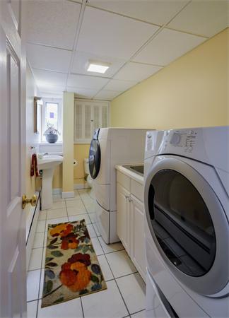 48 Prospect Road Andover, MA 01810 - Photo 18 of 23 a bed room with a bed and a washing machine