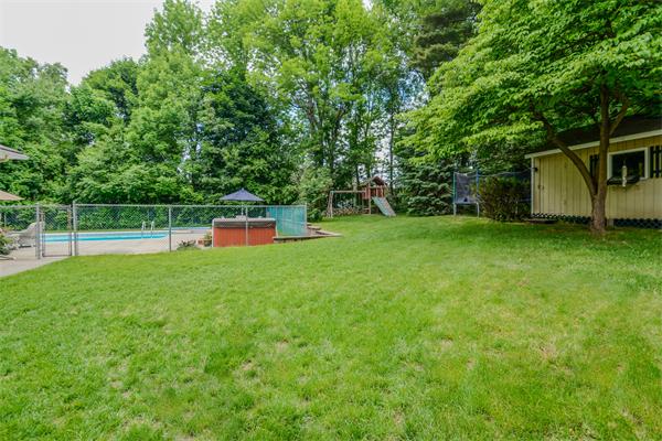48 Prospect Road Andover, MA 01810 - Photo 21 of 23 a view of a backyard with a garden