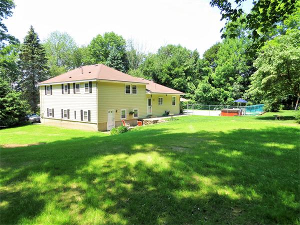 48 Prospect Road Andover, MA 01810 - Photo 23 of 23 a white house with a big yard and large trees