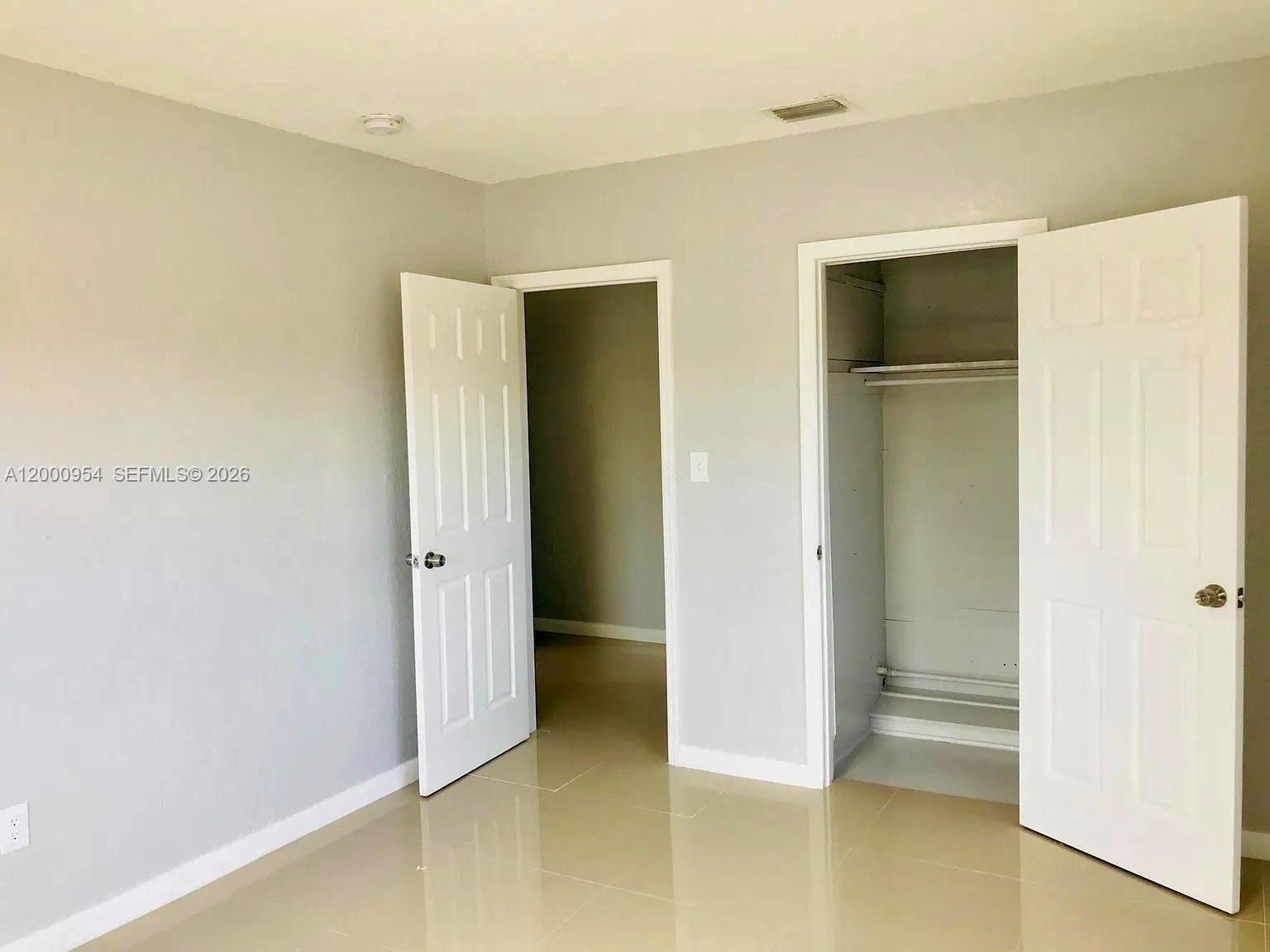 535 Northeast 68th Street, Unit UPSTAIRS Miami, FL 33138 - Photo 12 of 14 a view of an empty room