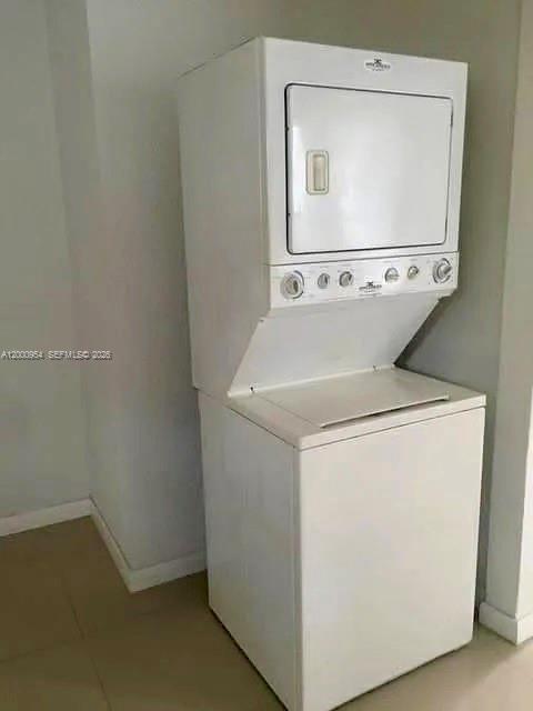 535 Northeast 68th Street, Unit UPSTAIRS Miami, FL 33138 - Photo 13 of 14 a utility room with dryer and washer