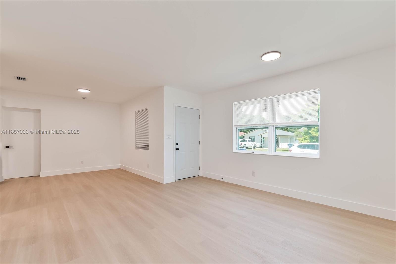 1366 Northwest 75th Street Miami, FL 33147 - Photo 13 of 26 an empty room with windows