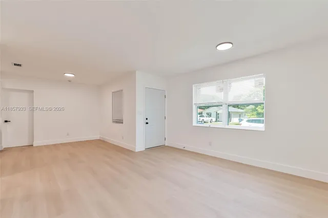 an empty room with windows