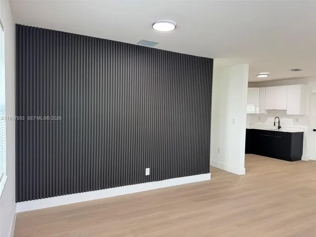 a view of kitchen with refrigerator