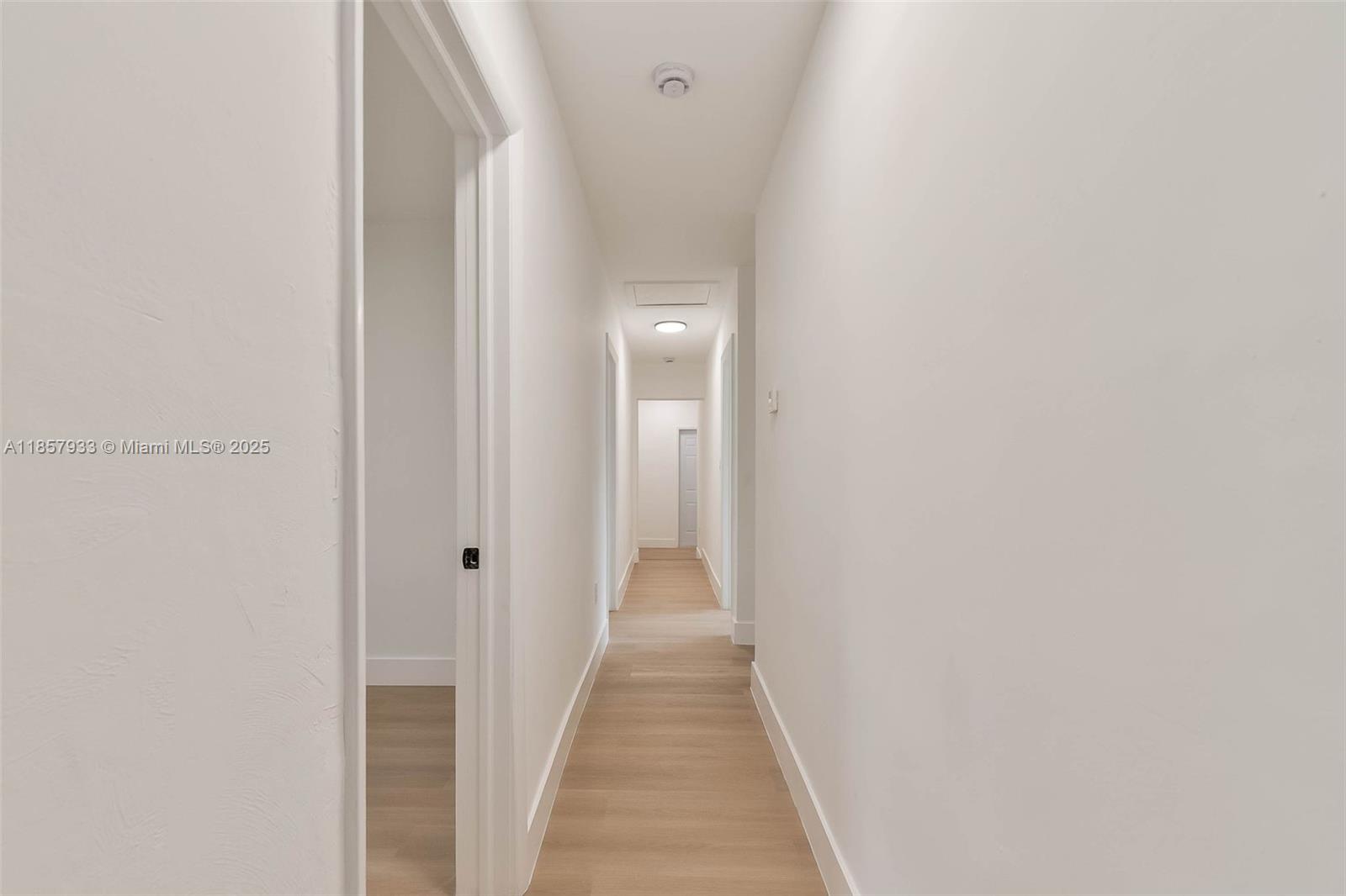 1366 Northwest 75th Street Miami, FL 33147 - Photo 5 of 26 a view of a hallway with wooden floor