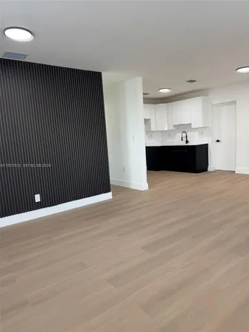 a view of kitchen and kitchen with a sink