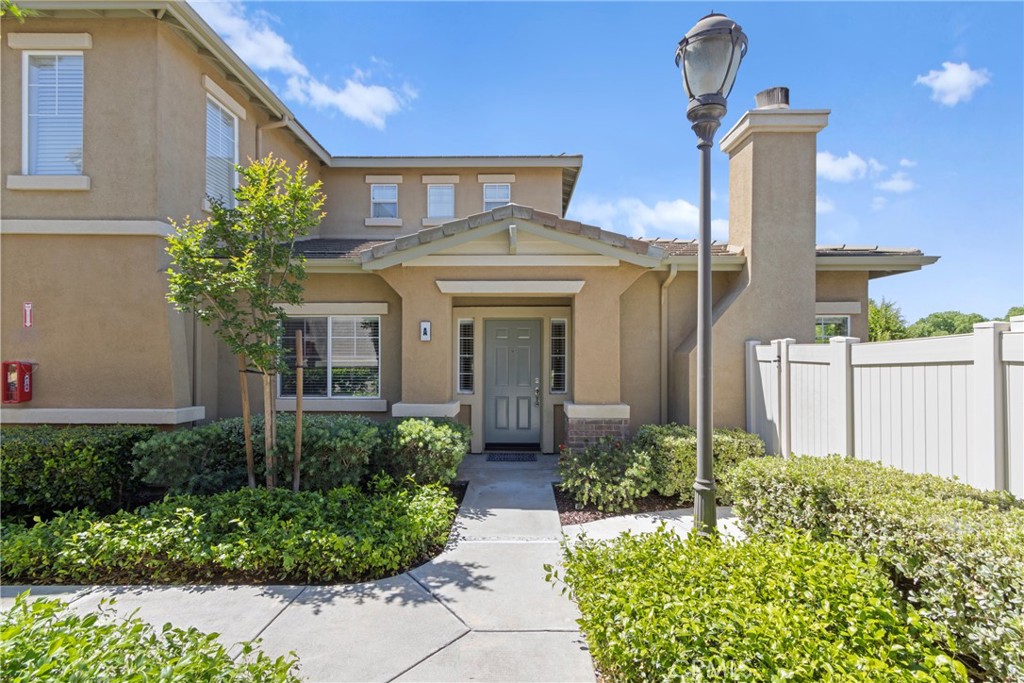 33576 Winston Way, Unit A Temecula, CA 92592 - Photo 2 of 44 a front view of a house with garden