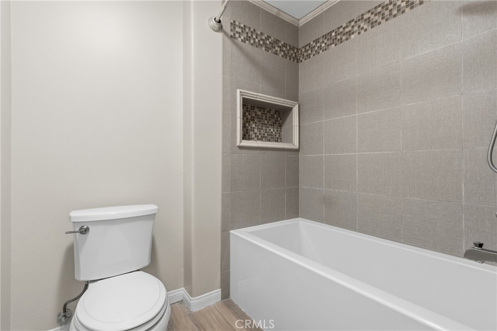 33576 Winston Way, Unit A Temecula, CA 92592 - Photo 24 of 44 a bathroom with a toilet a sink and bathtub