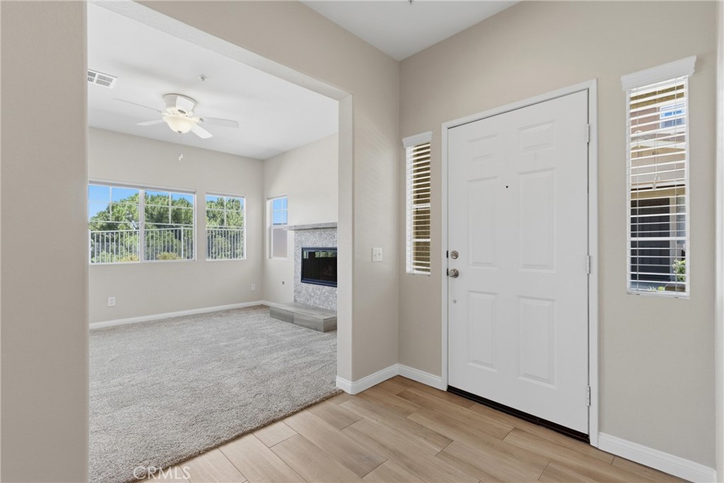33576 Winston Way, Unit A Temecula, CA 92592 - Photo 3 of 44 an empty room with windows and closet