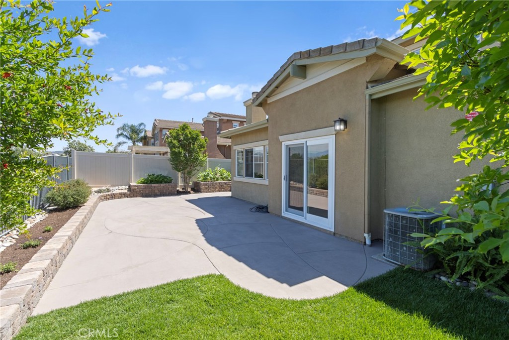 33576 Winston Way, Unit A Temecula, CA 92592 - Photo 33 of 44 a front view of a house with a yard and potted plants