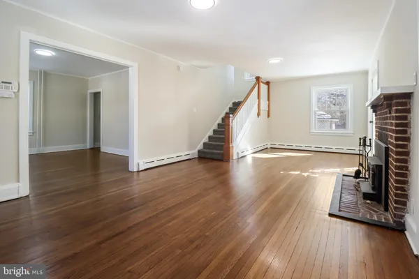 a view of entryway with wooden floor