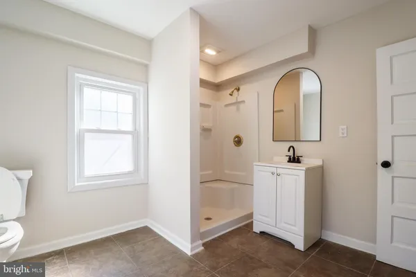 a view of a bathroom with 2 sink window and a bathroom