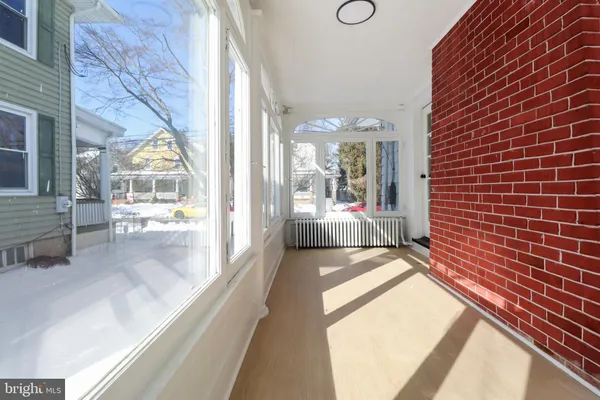 a view of a brick house with a outdoor space
