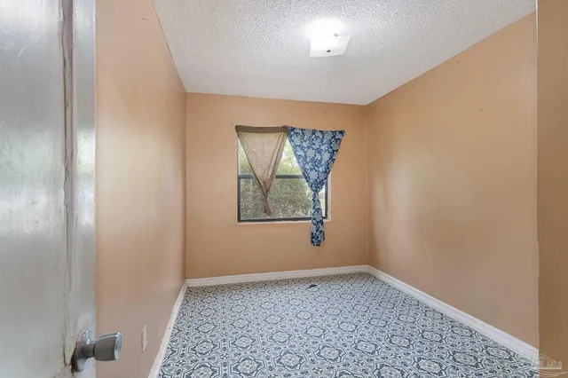 a view of a room with wooden walls