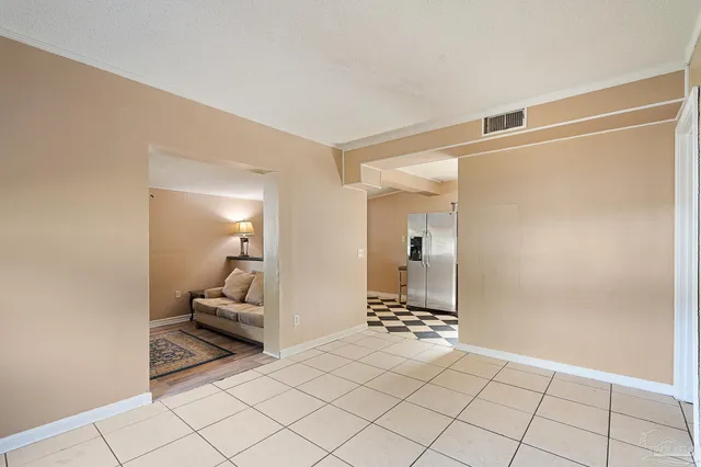 a living room with a fireplace and a walk in closet
