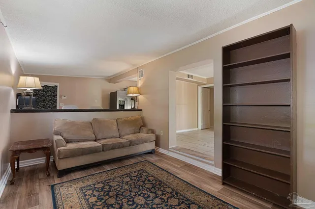 a living room with furniture and a rug