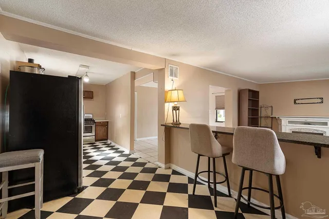 a kitchen with a sink cabinets and a window