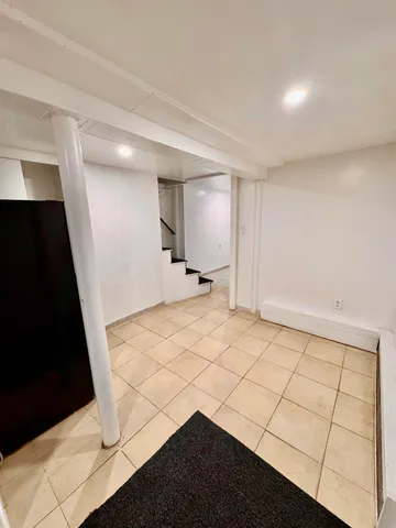 a view of an empty room and a sink