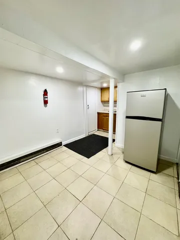 a kitchen with stainless steel appliances granite countertop a sink and a window