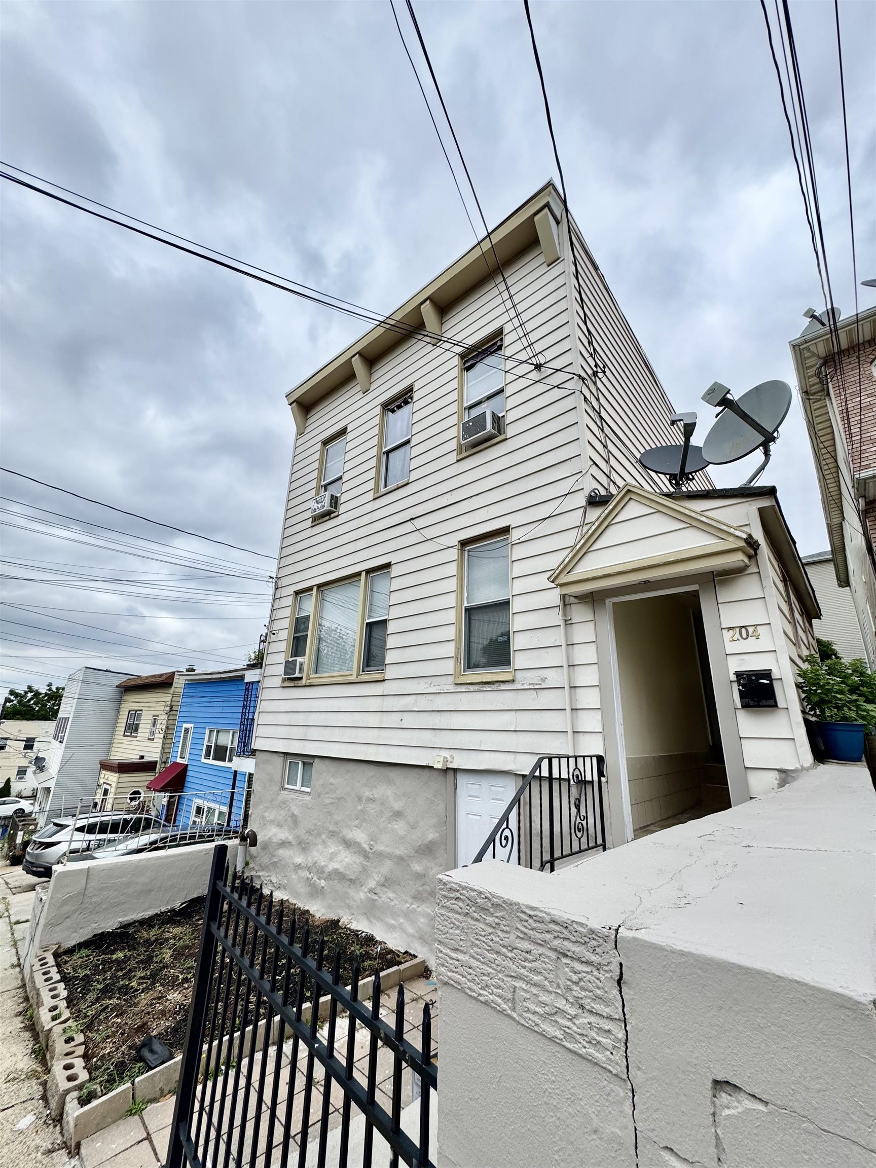 204 Zabriskie Street, Unit 1 & G Jersey City, NJ 07307 - Photo 20 of 21 a view of a house with a barbeque