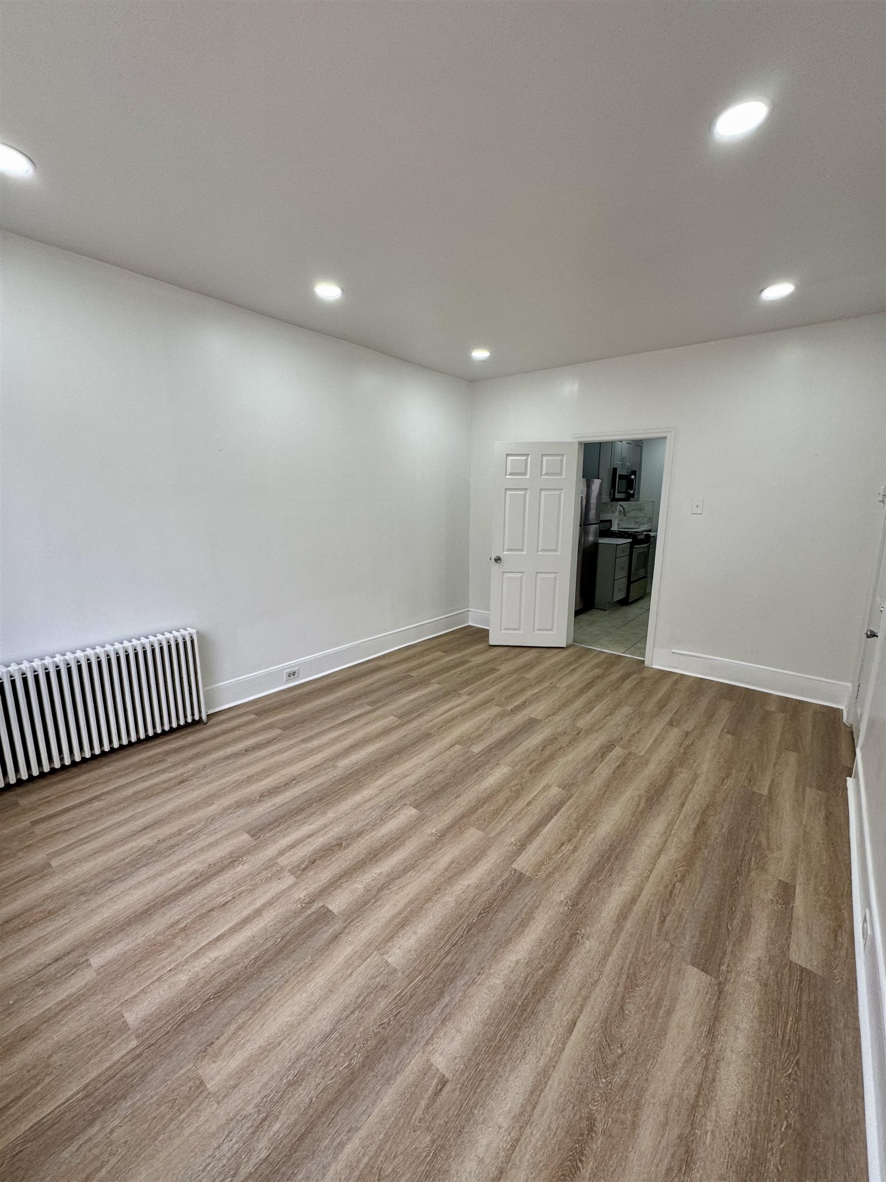 204 Zabriskie Street, Unit 1 & G Jersey City, NJ 07307 - Photo 7 of 21 a view of a room with wooden floor