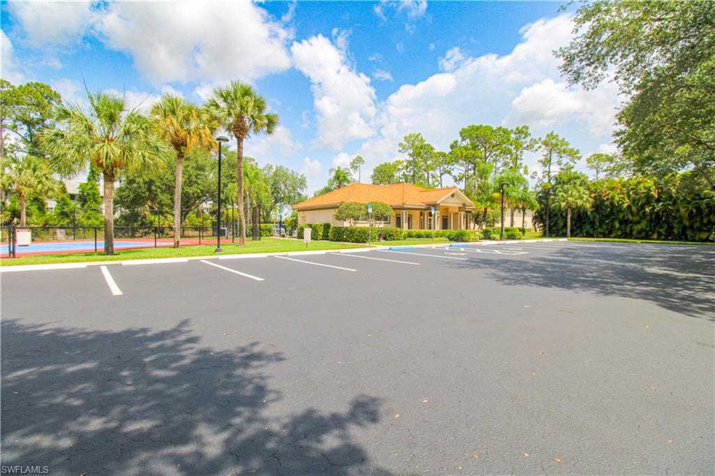225 Robin Hood Circle, Unit 203 Naples, FL 34104 - Photo 43 of 50 View of car parking
