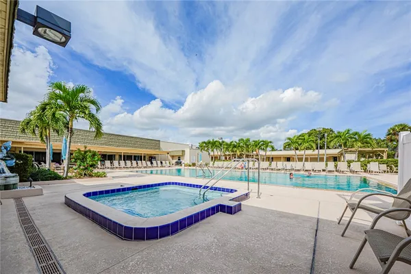 a view of a swimming pool with a patio