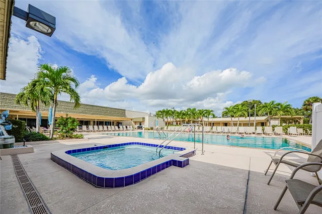 a view of a swimming pool with a patio