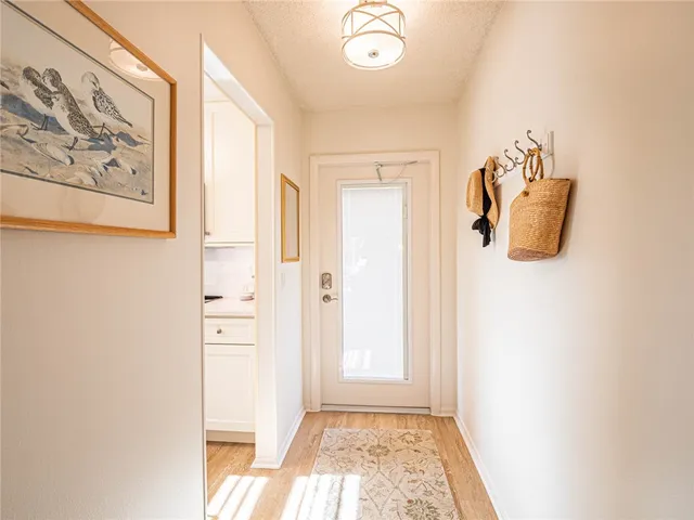 a view of a hallway with front door