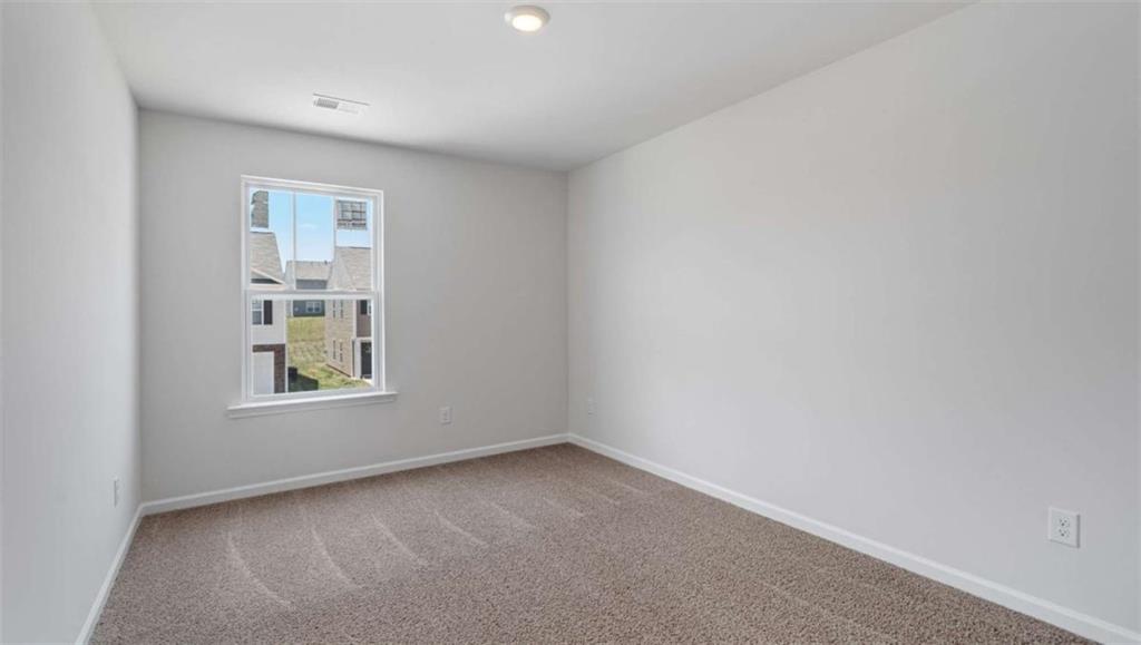 713 Meteor Drive Mableton, GA 30126 - Photo 3 of 11 an empty room with a window