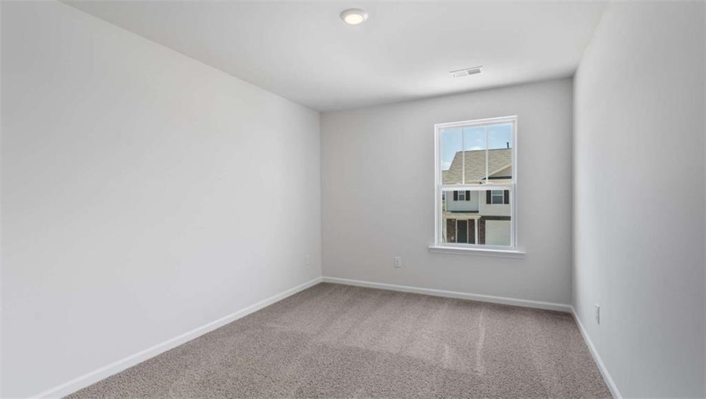 713 Meteor Drive Mableton, GA 30126 - Photo 5 of 11 an empty room with a window