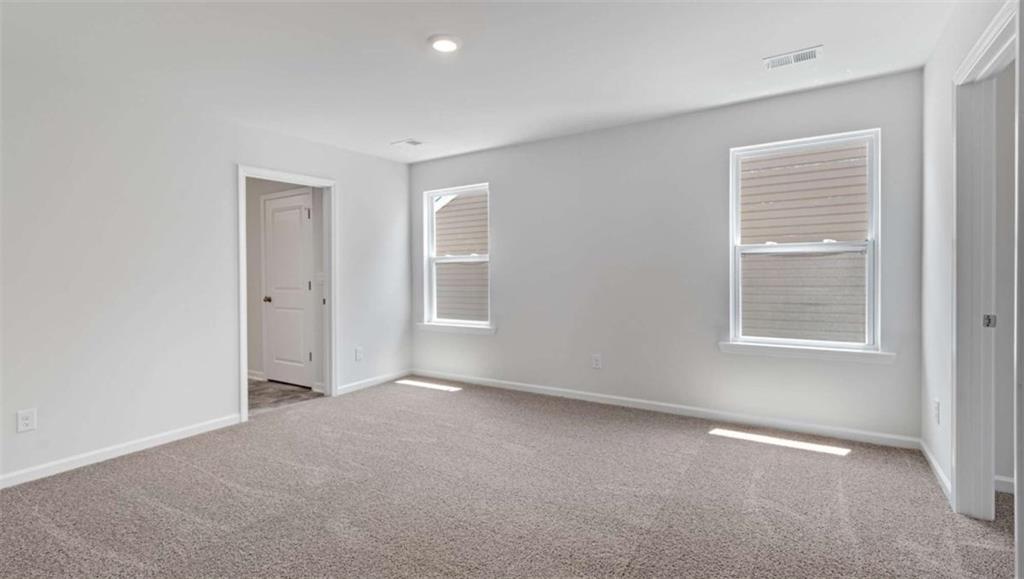 713 Meteor Drive Mableton, GA 30126 - Photo 8 of 11 a view of an empty room with a window