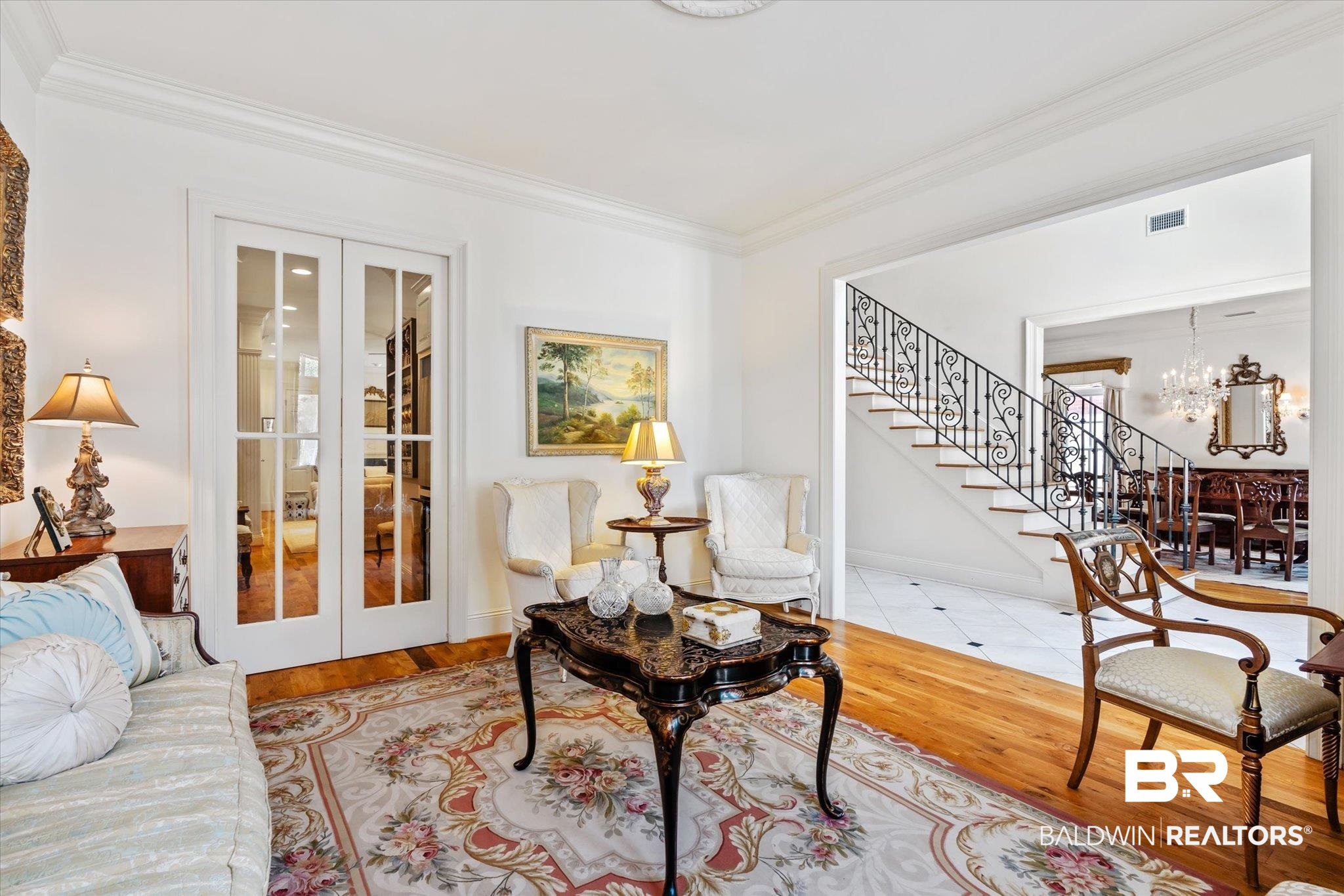 3963 Wimbledon Park Mobile, AL 36608 - Photo 6 of 51 Living room with ornamental molding, light hardwood / wood-style floors, an inviting chandelier, and french doors