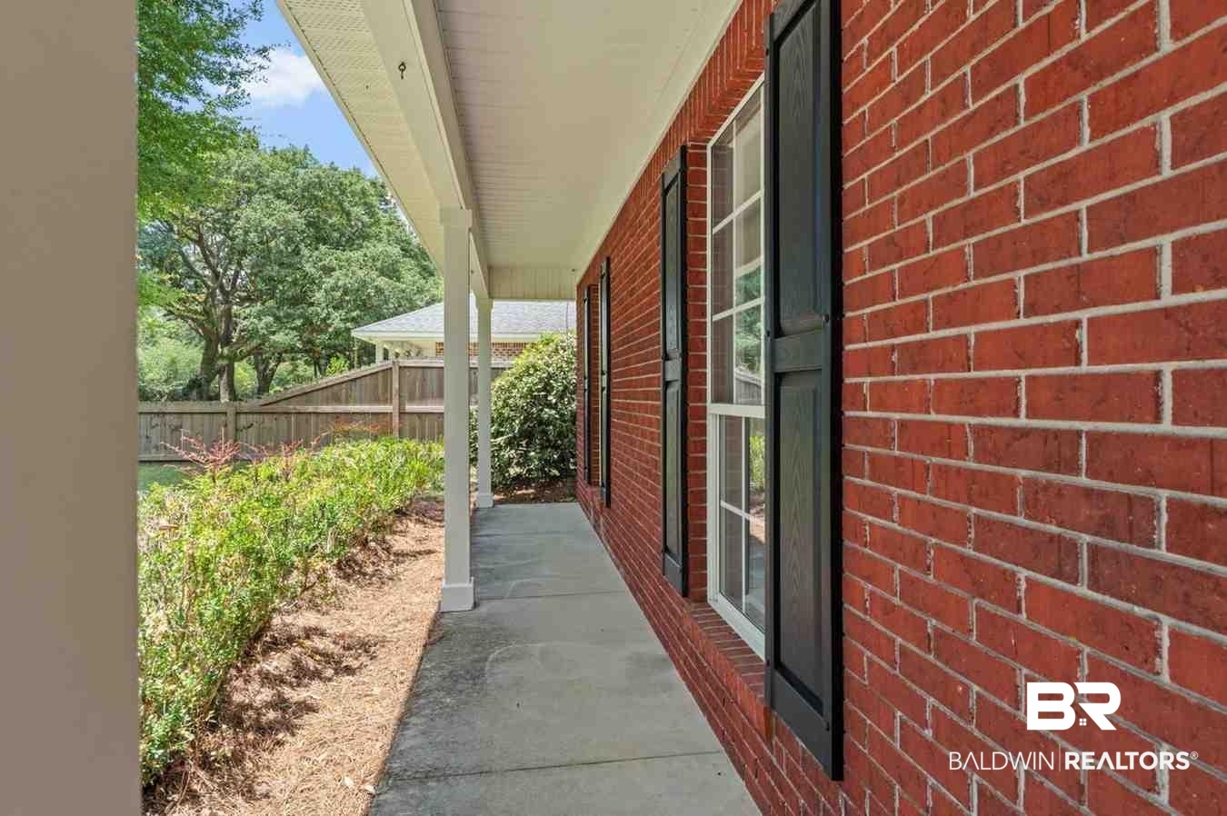 10251 Windmill Road Fairhope, AL 36532 - Photo 10 of 44 View of home's exterior featuring brick siding