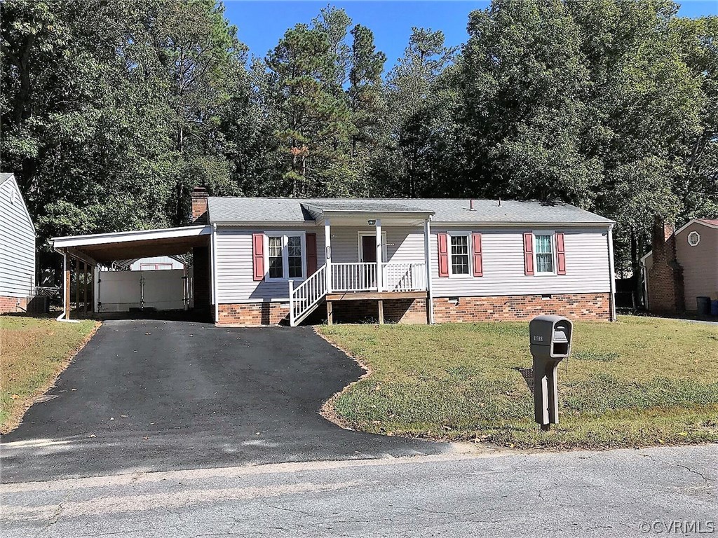 16031 Tri Gate Road Chester, VA 23831 - Photo 1 of 17 a front view of a house with garden