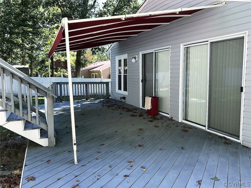 16031 Tri Gate Road Chester, VA 23831 - Photo 3 of 17 a view of backyard with deck and wooden floor