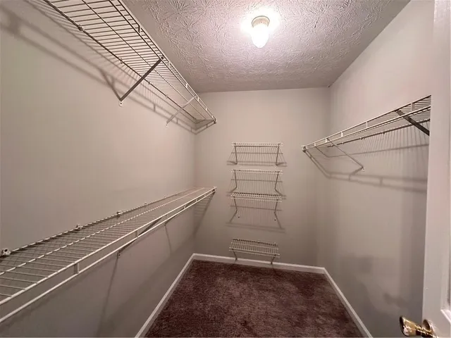 a view of a room with racks on the wall