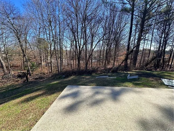 a view of backyard with green space