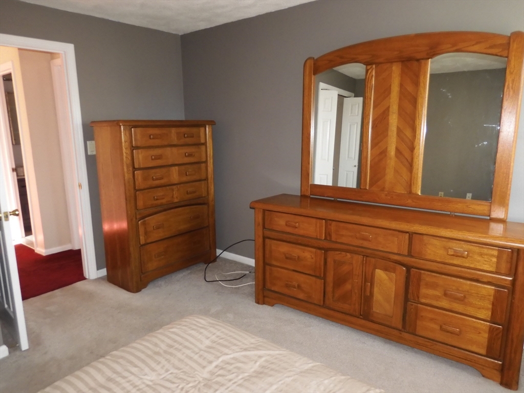 115 Merrimack Road, Unit 115 Methuen, MA 01844 - Photo 18 of 23 a view of walk in closet with furniture